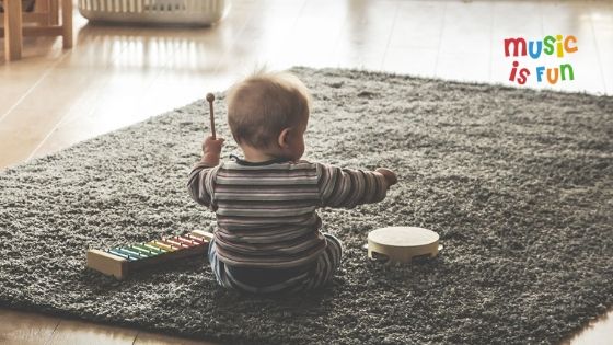 kid playing music